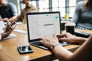 woman going through her email list | OnSpot Social